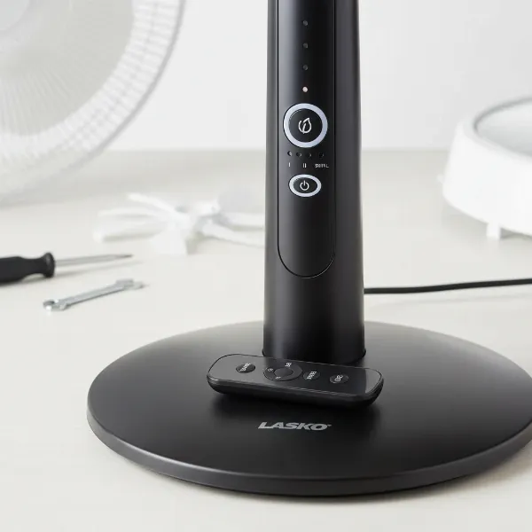 Lasko Cyclone pedestal fan and remote control, highlighting easy assembly and user convenience.