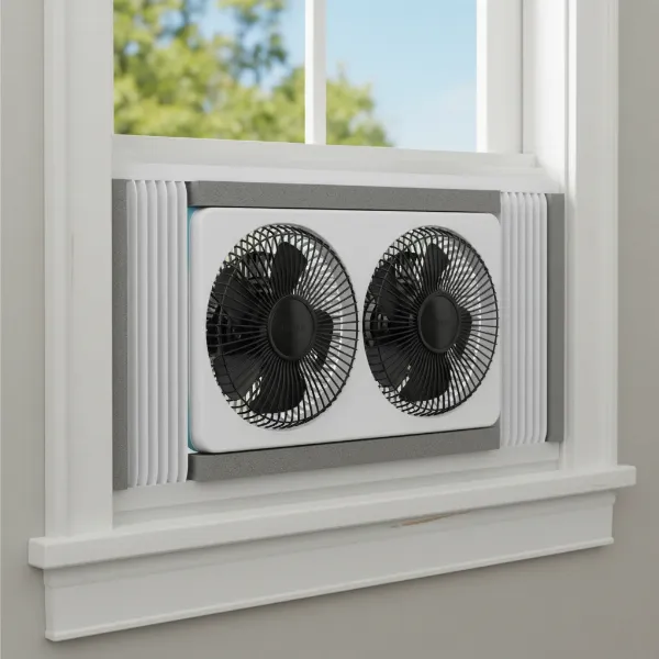 Close-up of a window fan securely installed with expandable accordion panels creating a tight seal